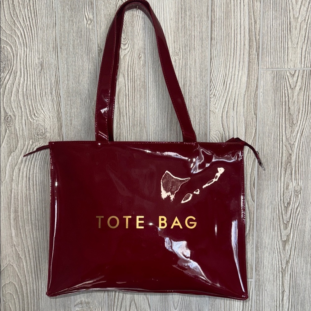 Glossy Red Tote Bag with Gold Lettering the perfect traveling bag